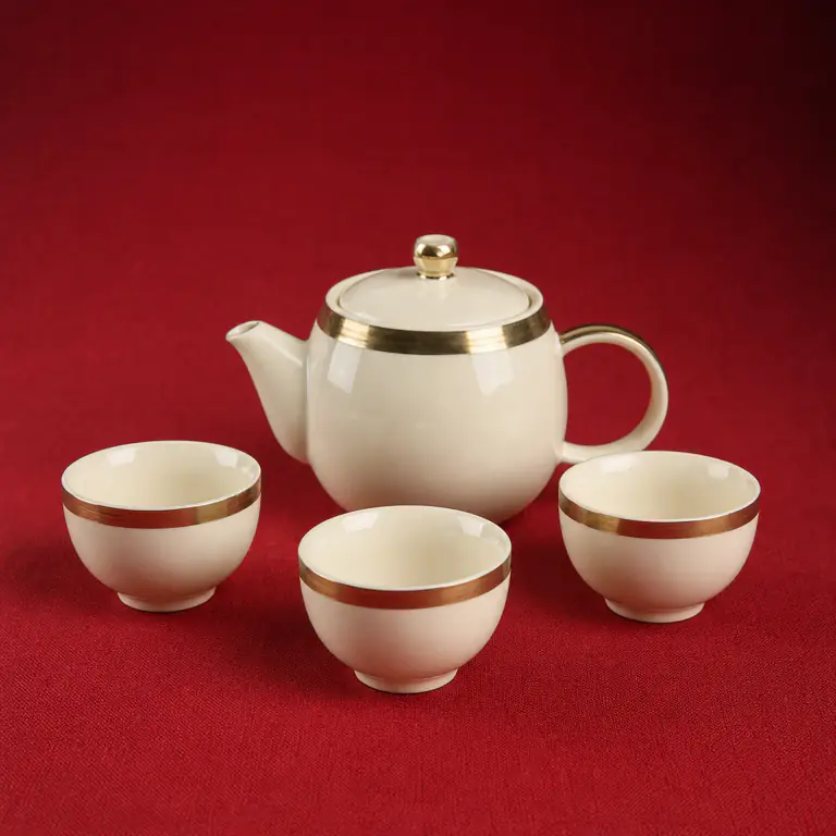 Ivory Glazed Tea Set shown on a red studio background