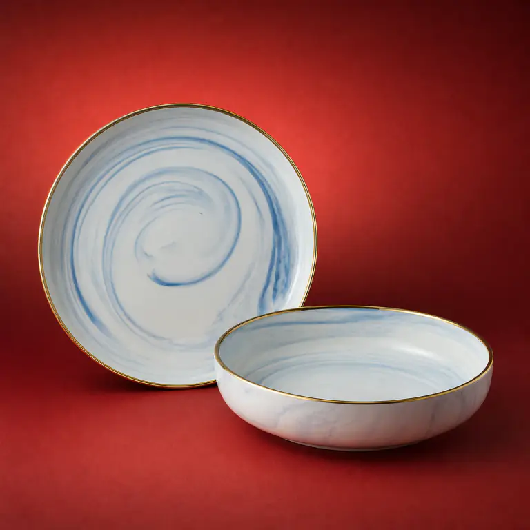 Blue Marble Tableware shown on a red studio background
