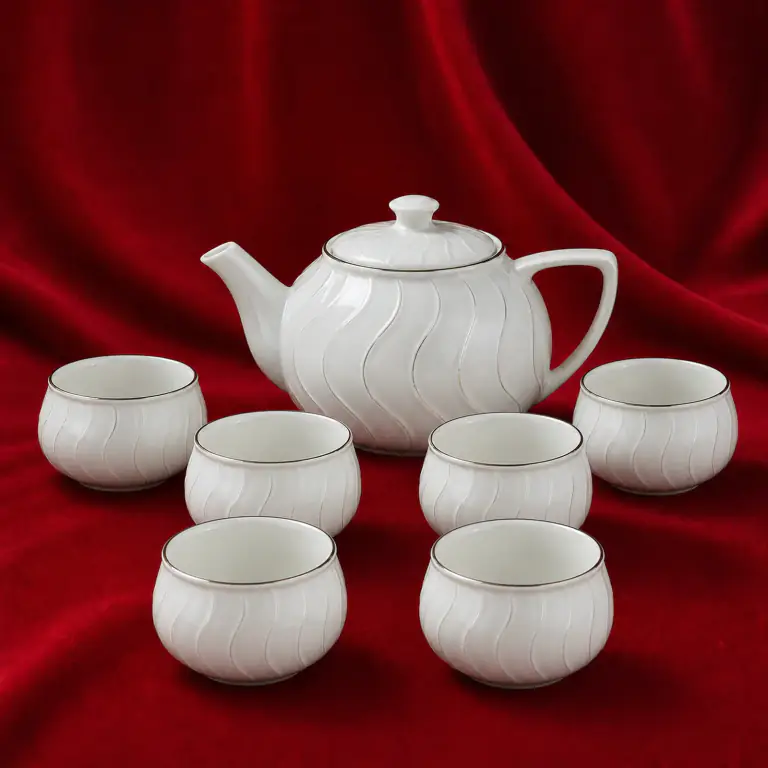 Wave Relief Tea Set shown on a red studio background