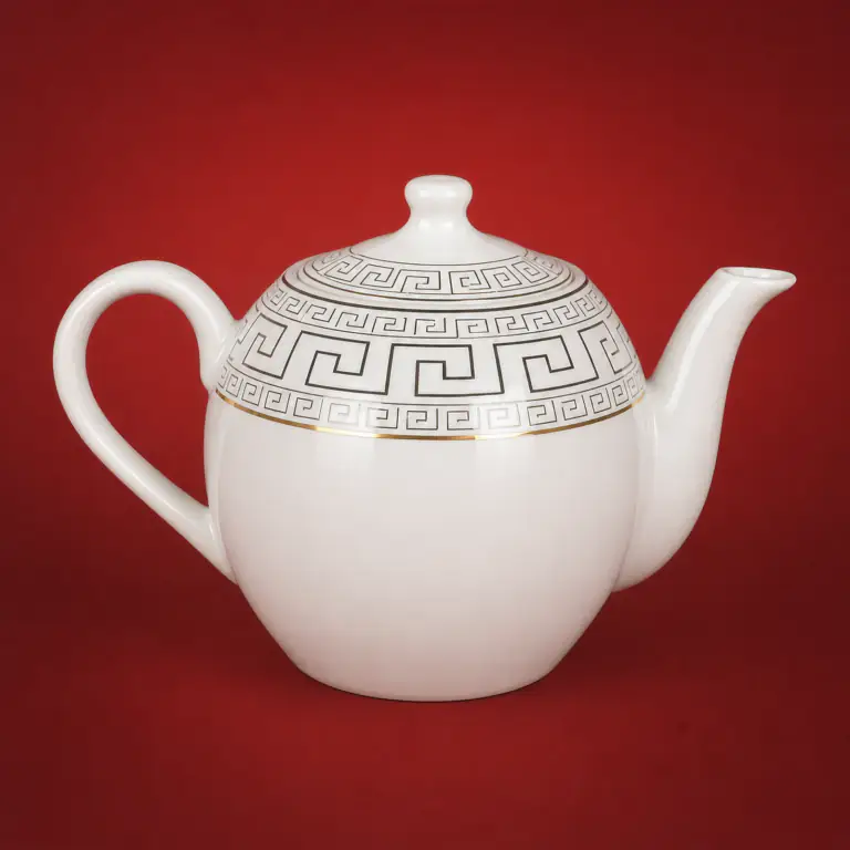 Geometric Ink Decal Teapot shown on a red studio background