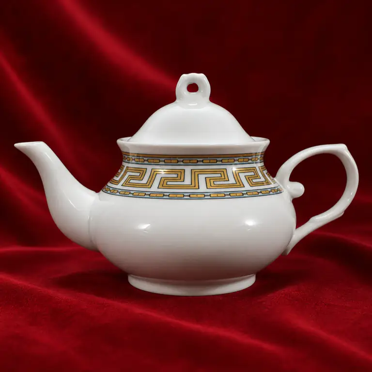 Ornamental Ink Decal Teapot shown on a red studio background