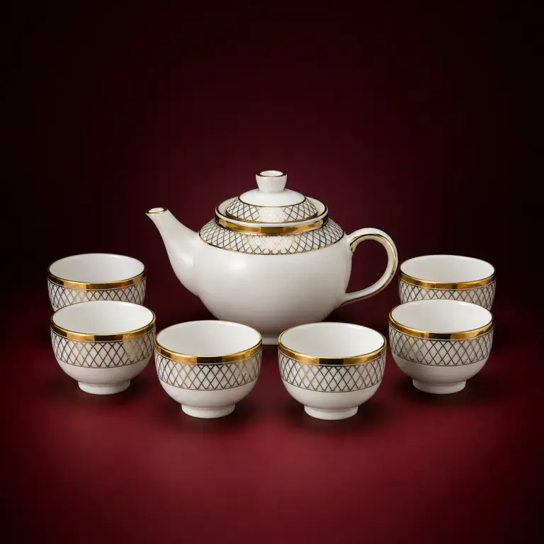 Gold Decal Tea Set shown on a red studio background
