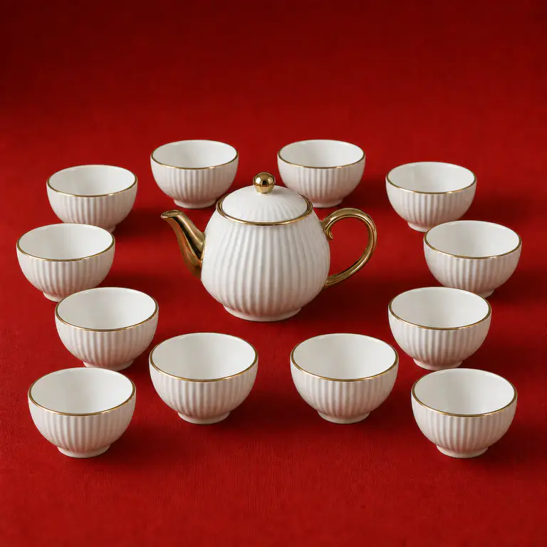 White Ribbed Tea Set shown on a red studio background