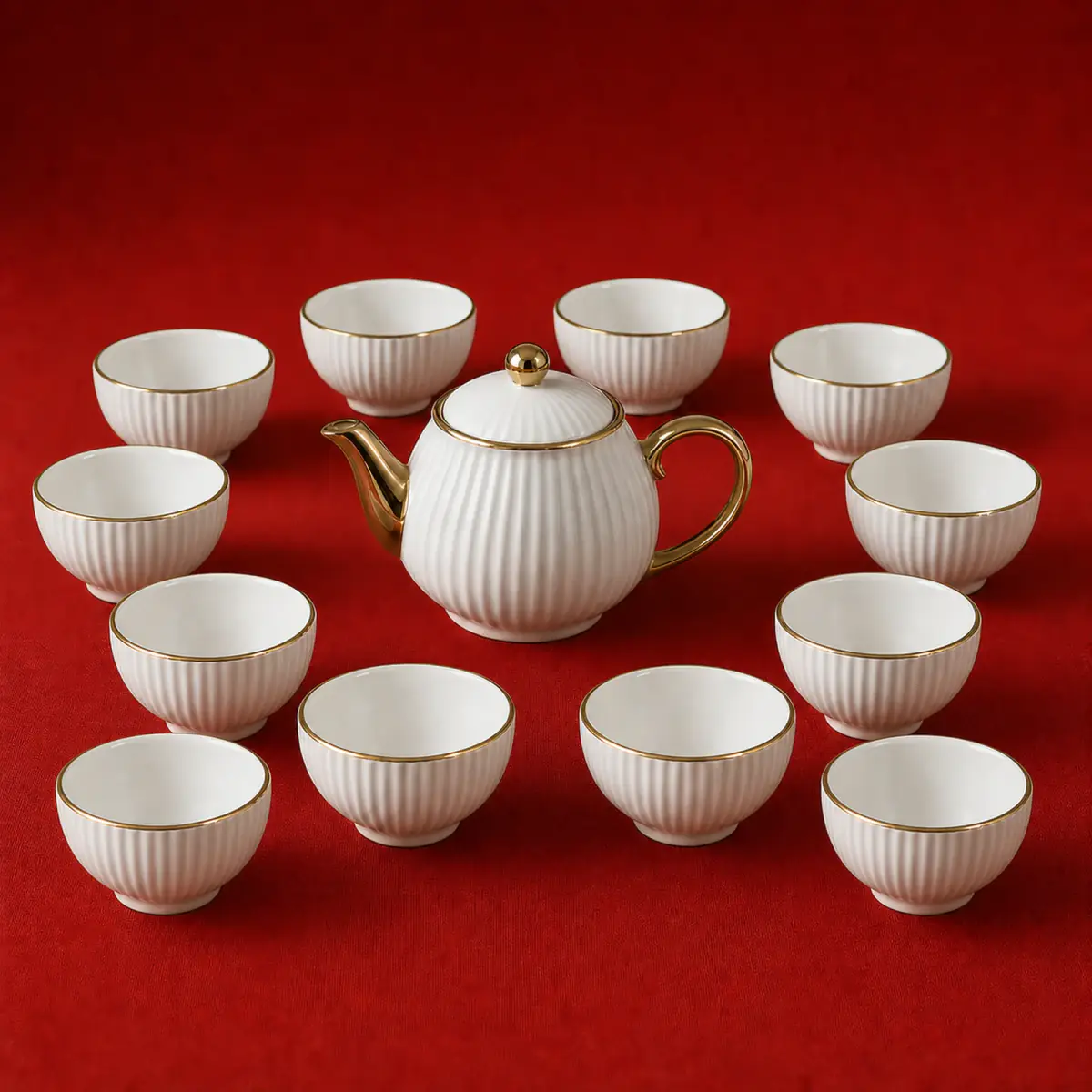 White Ribbed Tea Set shown on a red studio background