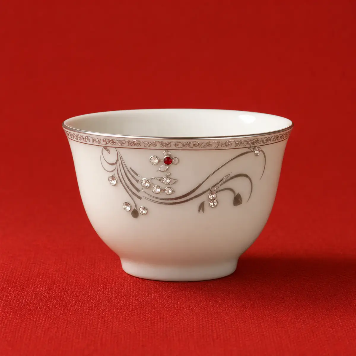 Ivory Beaded Tea Bowl shown on a red studio background