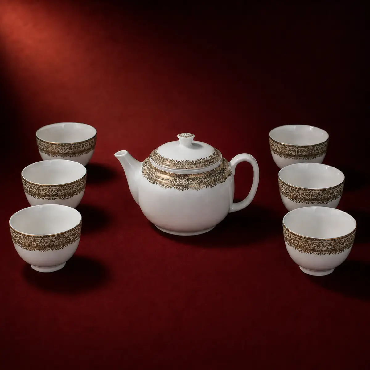 Decorated White Tea Set shown on a red studio background