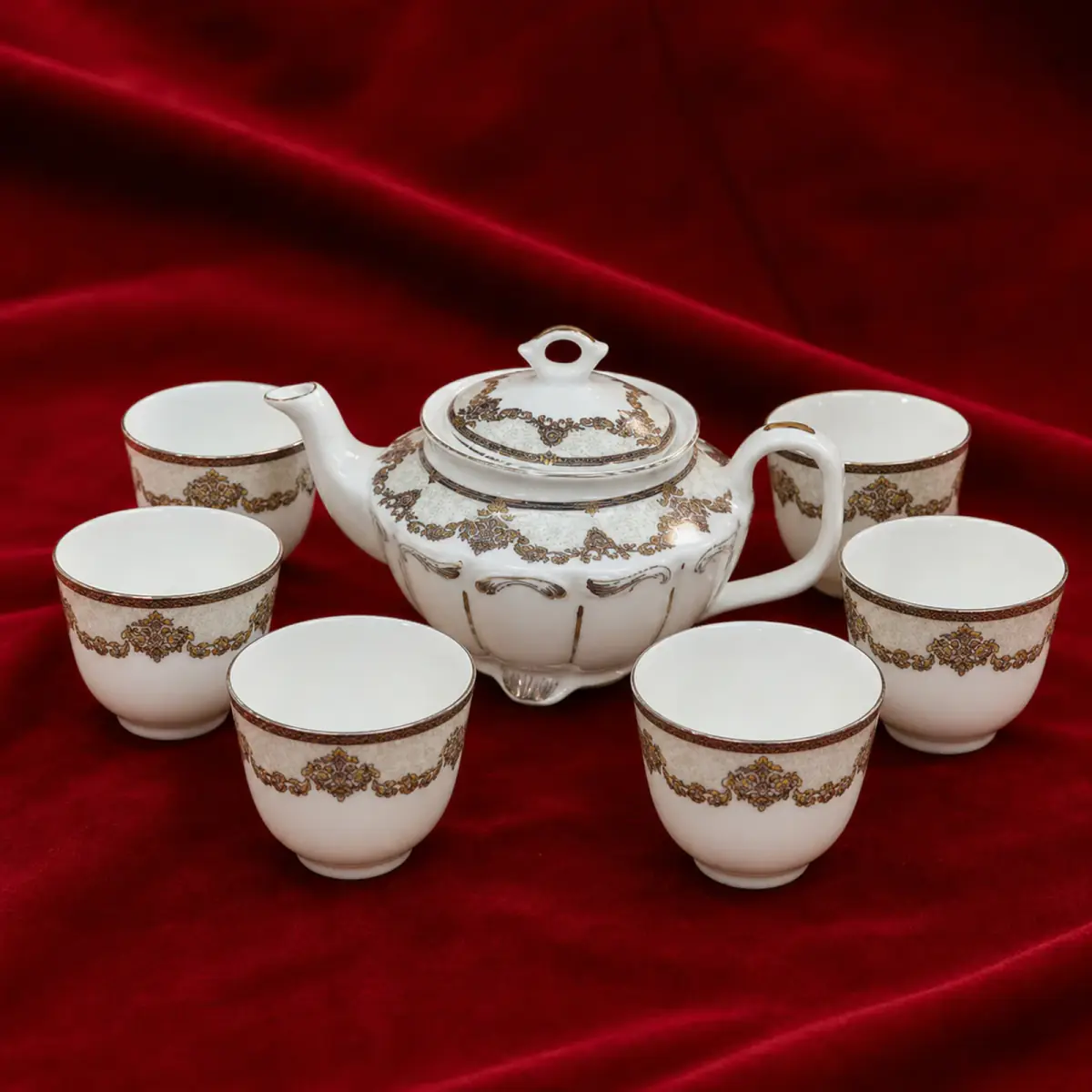 Ornamental White Tea Set shown on a red studio background