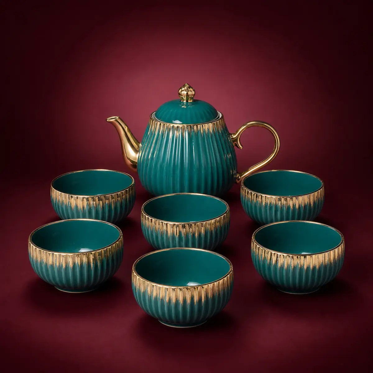 Green Brushed Gold Tea Set shown on a red studio background