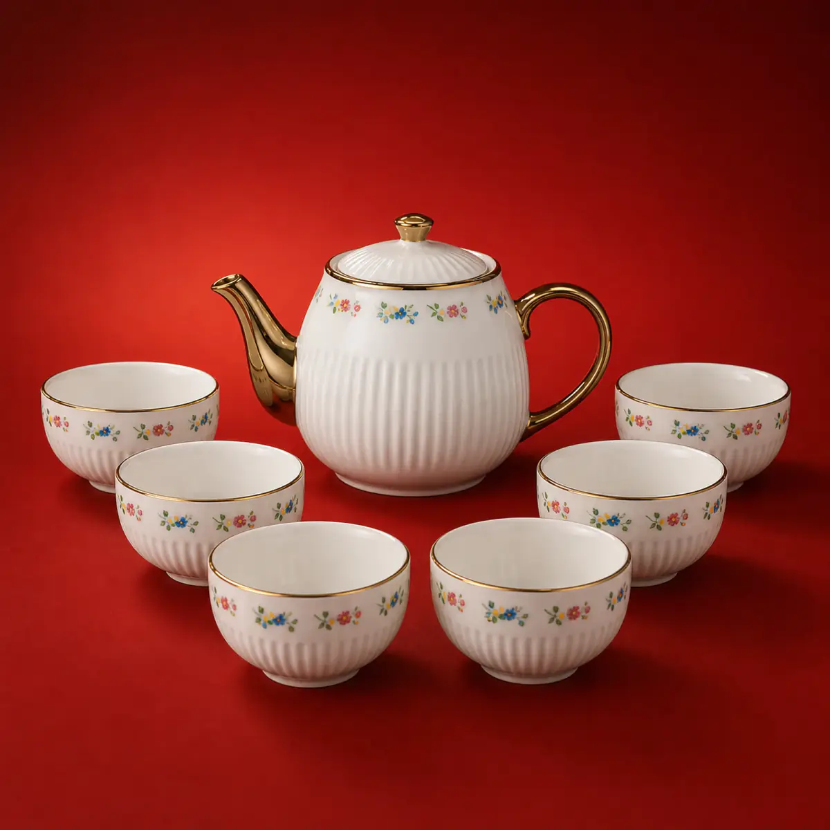 Floral Resist Decal Tea Set shown on a red studio background