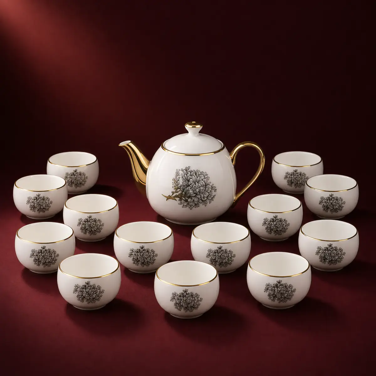 Monochrome Resist Decal Tea Set shown on a red studio background