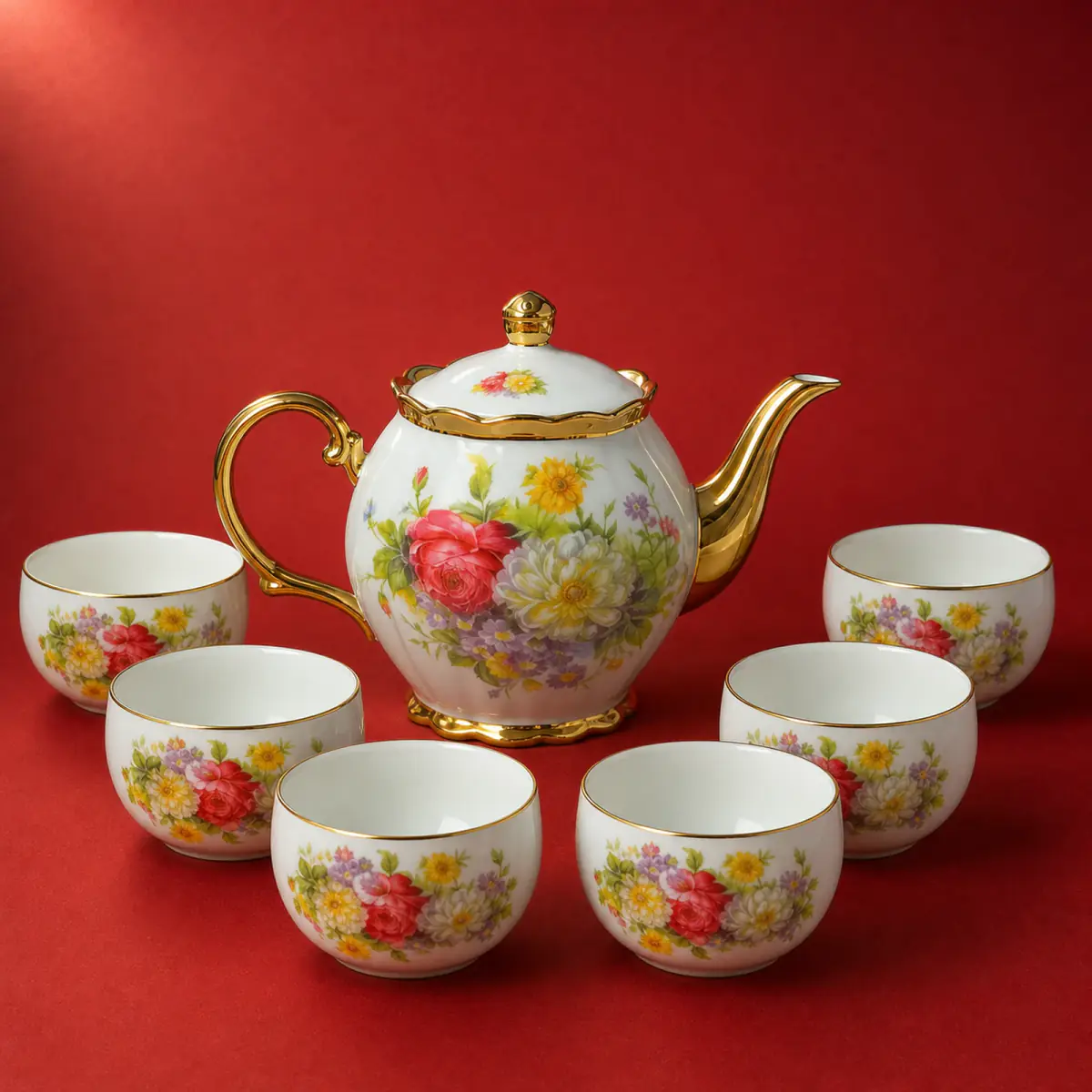 Floral Electroplated Decal Tea Set shown on a red studio background