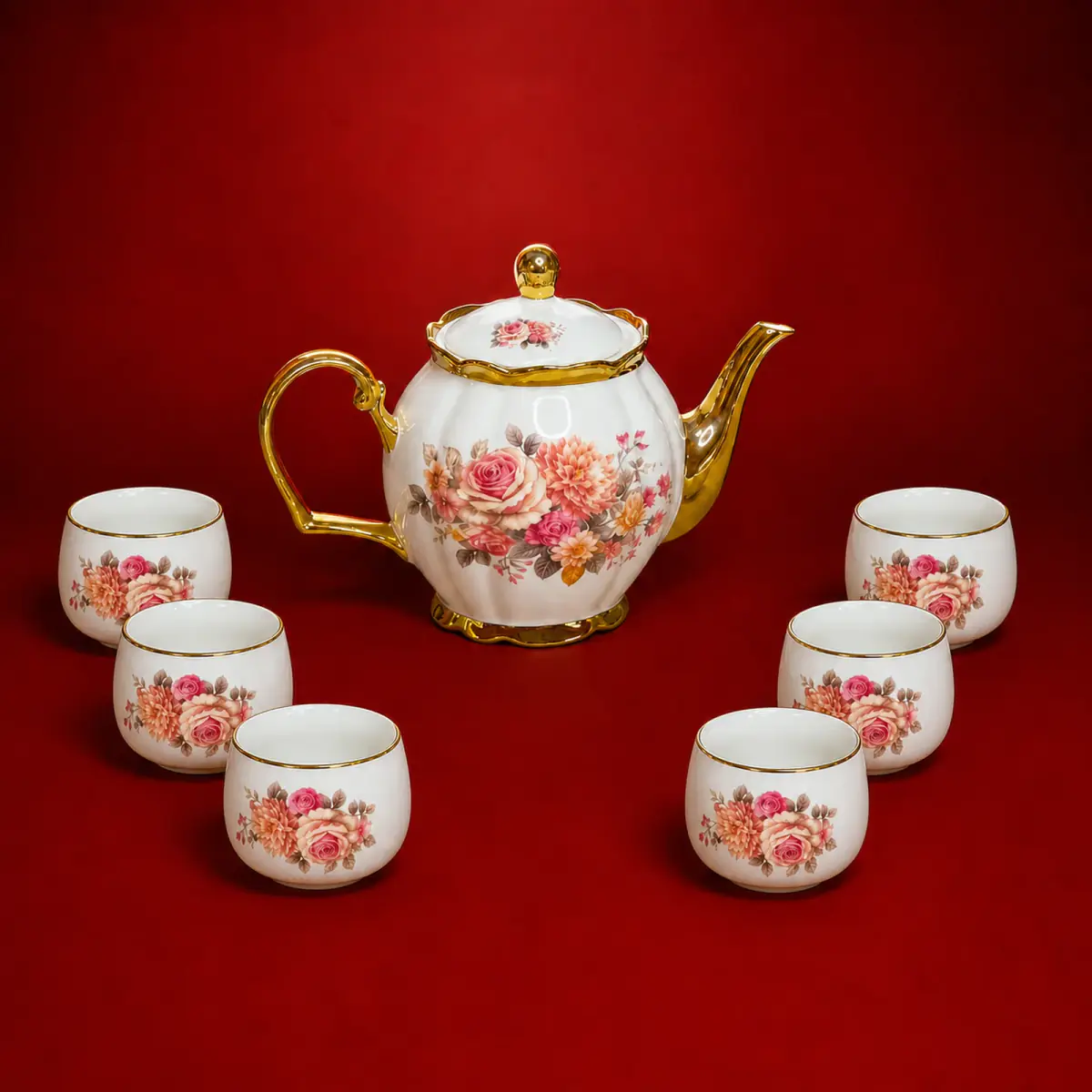 Pink Electroplated Decal Tea Set shown on a red studio background